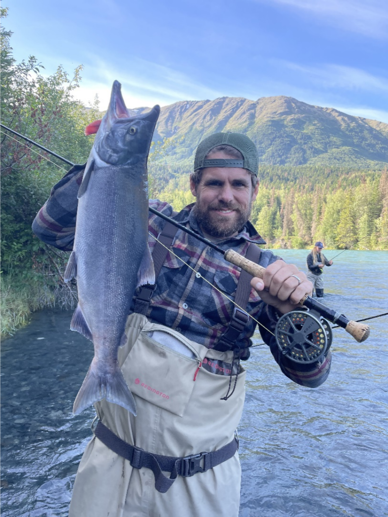 an angler holding sockeye salmon