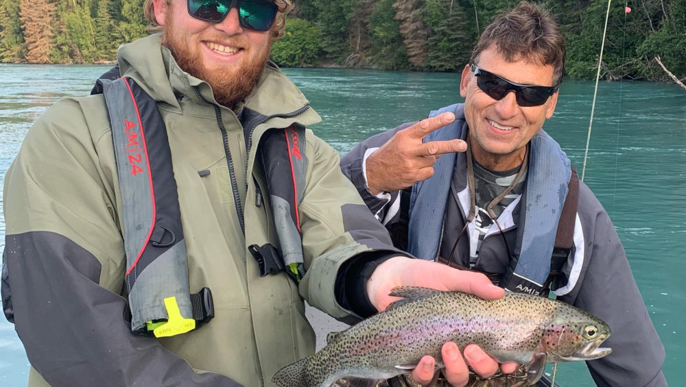 anglers holding rainbow trout on the Kenai River