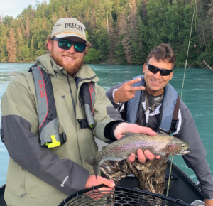 anglers holding rainbow trout on the Kenai River
