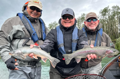 ishing guide Jason Lesmeister and fellow anglers holding fish on the Kenai River