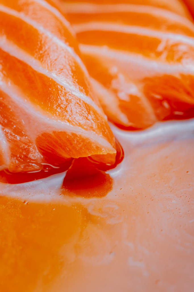 A close-up of fresh salmon fillets.